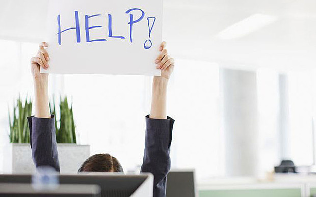 A man rising his hands with a help sign